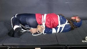 Marie bound and gagged in shiny nylon Rainwear