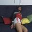 Katharina tied and gagged on a sofa wearing a shiny white nylon shorts and a shiny red/blue oldschool rain jacket (Video)