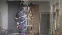 Myxxxy bound and gagged in a shiny nylon Rainsuit