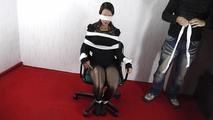Isi tied up on the chair with towels 1/2