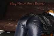 Watching sexy Sandra wearing a sexy blue shiny nylon pants and a rain jacket being tied and gagged with ropes and a clothgag on a stool (Pics)