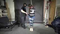Poor Marie bound and gagged in a shiny nylon Windbreaker
