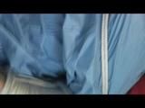 Julia tied and gagged on a sofa wearing a shiny light blue/beige PVC suit (Video)