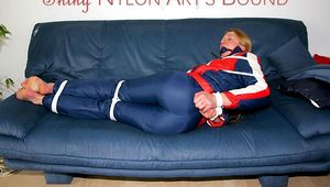 Beautiful archive girl tied and gagged wearing an wonderful oldschool shiny downwear (Pics)