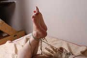 Amanda ties up and gags a man, then spanks and tickles him