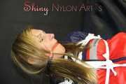 SANDRA being tied and gagged overhead with ropes and a clothgag wearing a sexy oldschool shiny nylon shorts and a rainjacket (Pics)