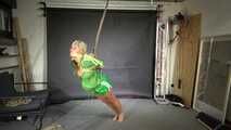 Alice bound and gagged in shiny nylon Shorts and Rainjacket