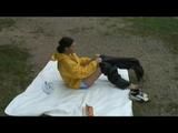 Being with Enni sitting at a lake wearing sexy shiny nylon rainwear (Video)