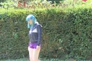 Mara wearing a purple shiny nylon shorts and a black rain jacket playing soccer (Pics)