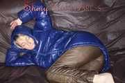 Sexy Sonja changing clothes to a brown down pants and a blue down jacket and lolling on the sofa (Pics)
