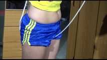 ***NEW MODEL*** Sandra wearing highheels and a sexy blue/yellow shiny nylon shorts and a yellow top tied and gagged with ropes (Video)