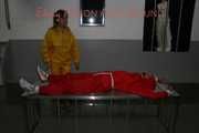 Watching Stella being tied and gagged with ropes and a ballgag on a operating table from Leonie both wearing sexy shiny nylon rainwear (Pics)