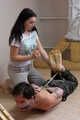 Hazel dominates Gregory, bit-gagged and hogtied with his hands in reverse prayer