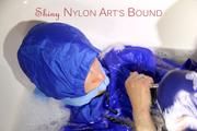 Sonja ties, gagges and hoodes herself in a bath tub wearing supersexy shiny nylon rainwear (Pics)