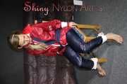 Sexy Sandra wearing sexy red/blue rainwear being tied and gagged with ropes and a clothgag on a chair (Pics)