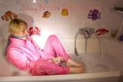 Sonja ties and gagges herself in the bath tub with cuffs wearing sexy shiny nylon downwear (Pics)
