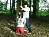 Two girls cuffed to a tree 2/2