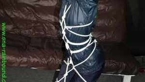 Watch Sonjy enjoying Bondage in her shiny nylon Rainwear