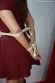 Laura tied up with ropes