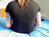 Lea wearing five very tight hose clamps on each arm
