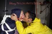 Sandra beeing tied and gagged by Stella in Shiny Nylon Rainwear crotchrope-suspended 