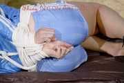 HOT HOT HOT PIA being tied and gagged on a sofa with ropes and a cloth gag wearing a sexy lightblue shiny nylon shorts and a lightblue rain jacket (Pics)