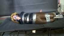 Rachel Adams bound, gagged and suspended in shiny nylon Down