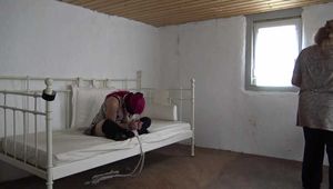 Lana roped on bed 2