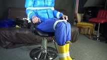 Sexy Pia being tied and gagged with ropes and a cloth gag on a hairdressers chair wearing a sexy blue shiny nylon rainpants and a lightblue downjacket (Video)