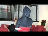 03:40 Min. video with Nicole tied and gagged in shiny nylon rainwear