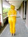 Leonie tied and gagged outdoor wearing shiny yellow rainwear (Pics)