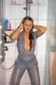 Stella wearing a supersexy grey rainwear catsuit under the shower (Pics)