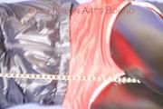 Mara ties and gagges herself with hand cuffs on a sofa wearing a supersexy black Leggings and a shiny nylon shorts and a rain jacket (Pics)