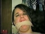 LATINA HOUSEKEEPER MOUTH STUFFED, WRAP AROUND ACE BANDAGE CLEAVE GAGGED & TIED TO CHAIR (D42-3)