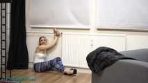 Vicky cuffed to the heater
