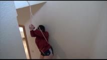 Jill tied and gagged over head wearing a sexy darkblue shiny nylon shorts and a red rain jacket (Video) 