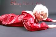 Blonde archive girl posing in a studio wearing a sexy red AGU rainwear combination (Pics)