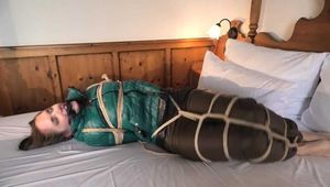 Rachel Adams tied and gagged in shiny Downwear