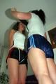 Petra tied and gagged by Jill in shiny shorts