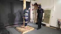 Lana tied and gagged and gagged to Post in shiny nylon Rainwear