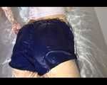 Watching Sandra wearing a sexy blue shiny nylon shorts and a top while playing with water in her bath tub (Video)