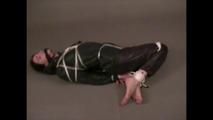 4 short videos in one of an beautiful black haired archive girl tied and gagged on the floor wearing sexy shiny nylon rainwear (Video)