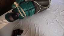 Rachel Adams tied and gagged in shiny Downwear
