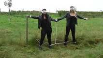Jasmin & Larissa tied on fence Photoshoot