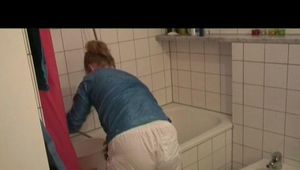 Jenny being at home wearing sexy white shiny nylon shorts and a blue rain jacket (Video)