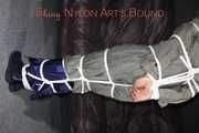 Sexy Sandra being tied and gagged overhead with ropes and a clothgag hodded wearing a sexy rainwear combination (Pics)