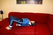 Isabelle tied and gagged in shiny nylon clothes