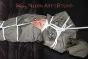 Sexy Sandra being tied and gagged overhead with ropes and a clothgag hodded wearing a sexy rainwear combination (Pics)