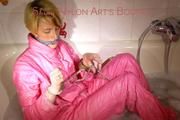 Sonja ties and gagges herself in the bath tub with cuffs wearing sexy shiny nylon downwear (Pics)