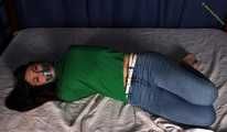 Roxana hogtied on bed